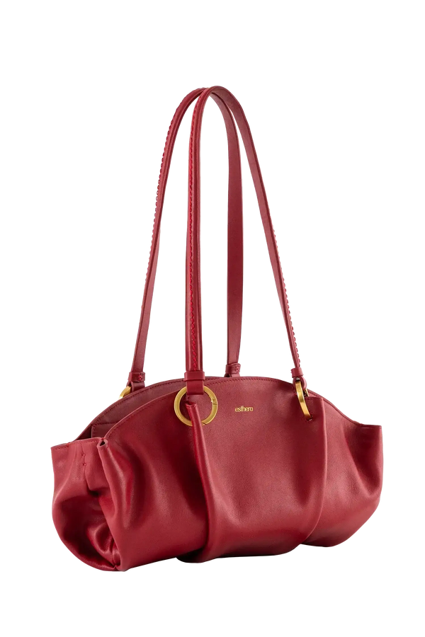 Bolsa baguette em couro legítimo na cor vermelha merlot com fechamento por zíper e alça de ombro confortável, design sofisticado e funcional ideal para o dia a dia.