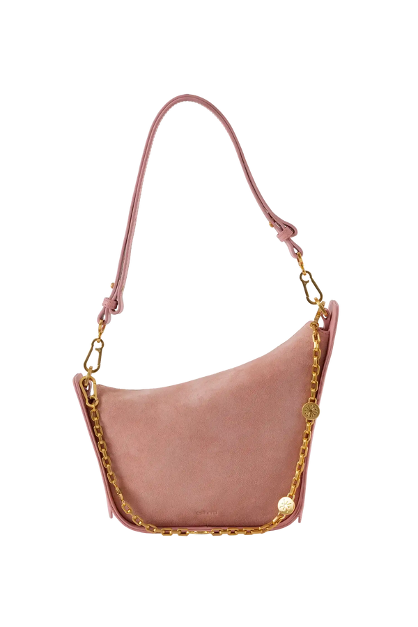 Bolsa em camurça na cor com tom elegante com fechamento por zíper e alça de ombro confortável, design sofisticado e funcional ideal para o dia a dia.